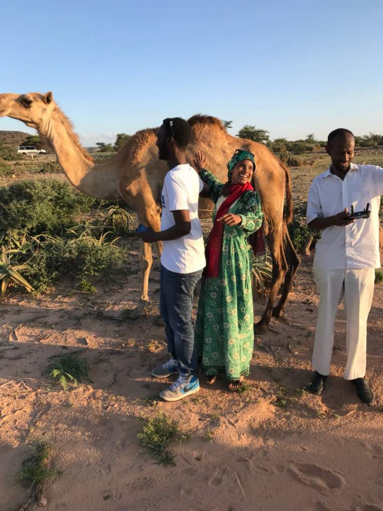 A beautiful camel with the Horn Heritage Drone team Mahamed Dahir and Sharmarke Sheikh  and Sada (Photo: Abdishakur Sulub)